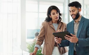 two people looking at iPad