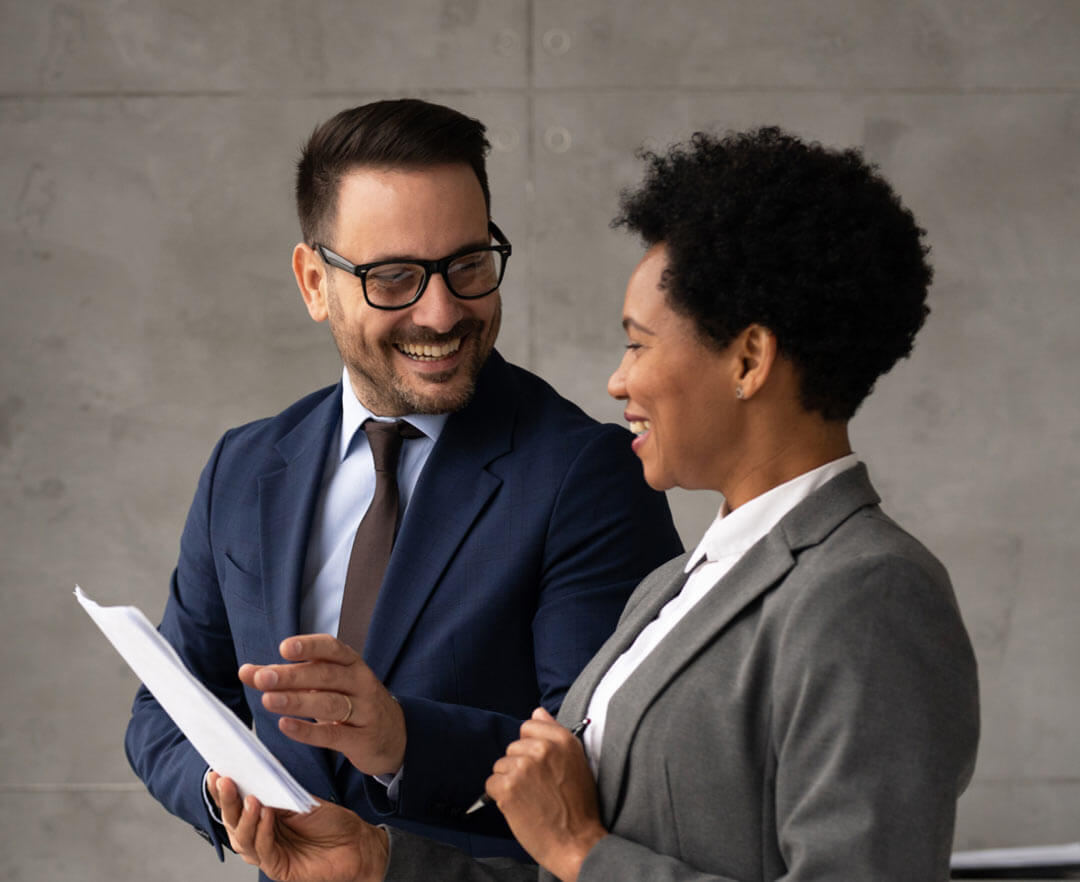 Professionals talking looking at documents