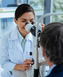 optometrist performing eye exam