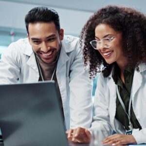 optometrists looking at laptop