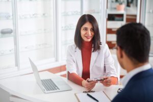 optometrist and client with glasses