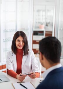 optometrist and client with glasses