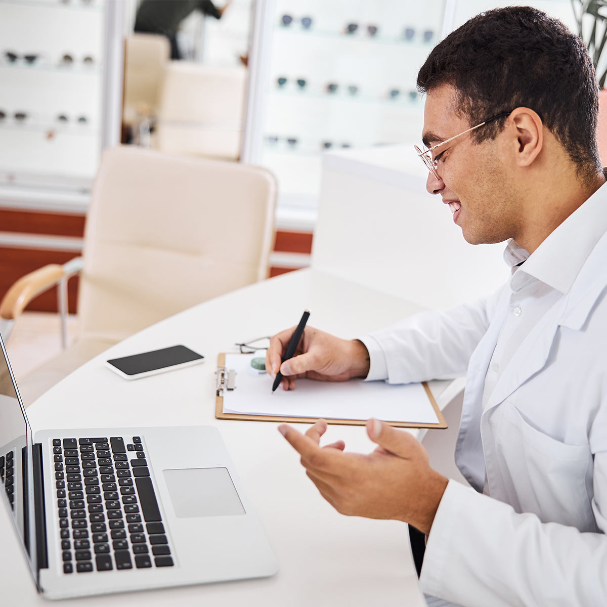 Optometrist on his laptop computer