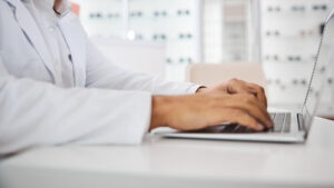 Optometrist on laptop PC