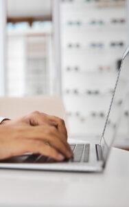 Optometrist on laptop PC