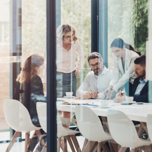 Team in a meeting reviewing documents