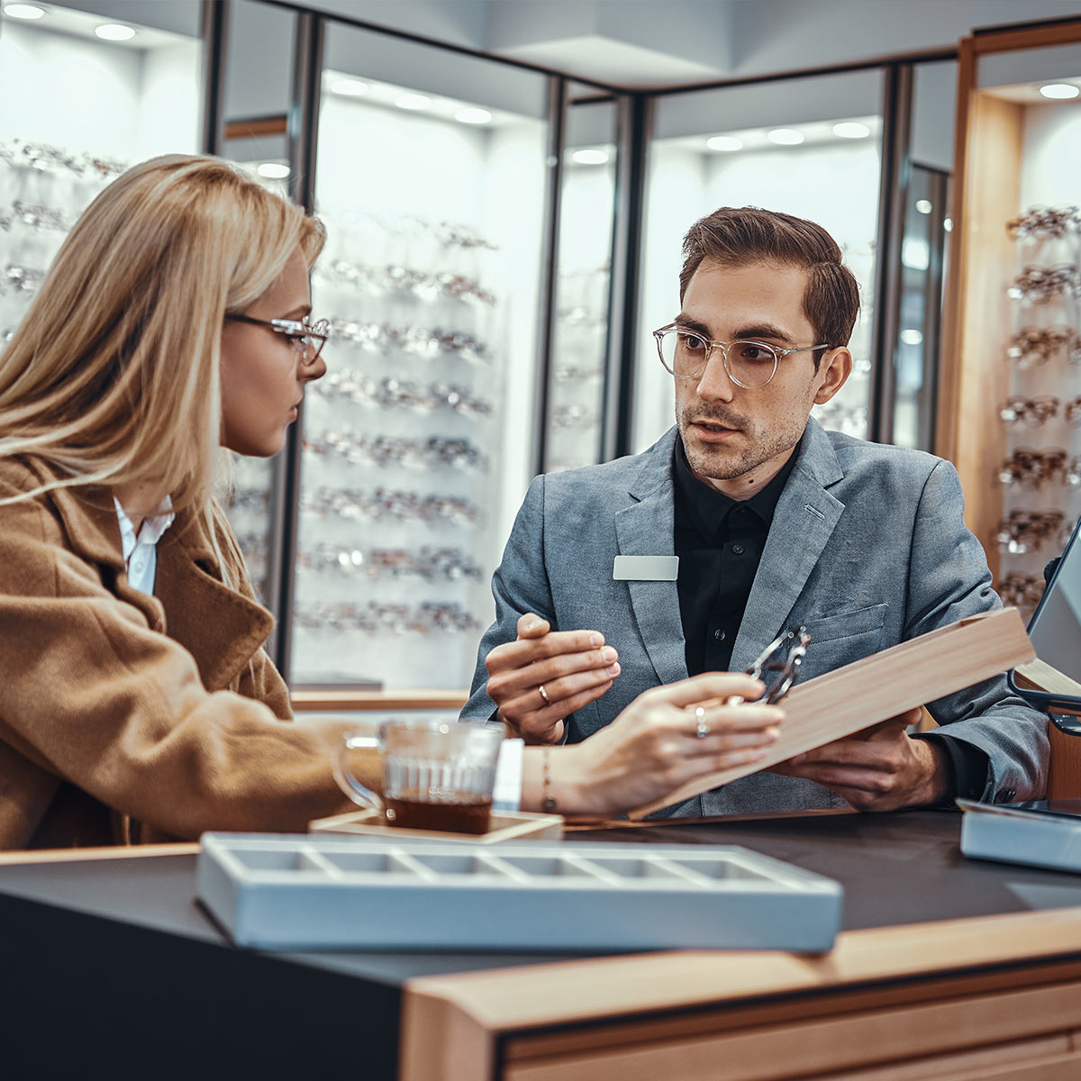 Frame Vendor showing frames to a practice owner